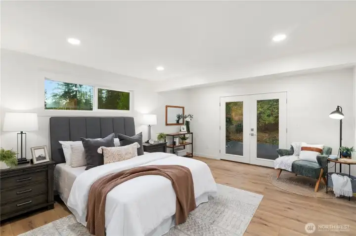 Huge deck off enormous primary suite with french doors.