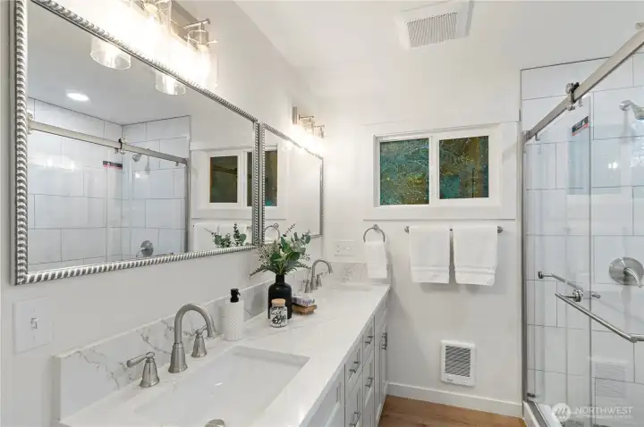 Luxurious primary bathroom with walk in closet.