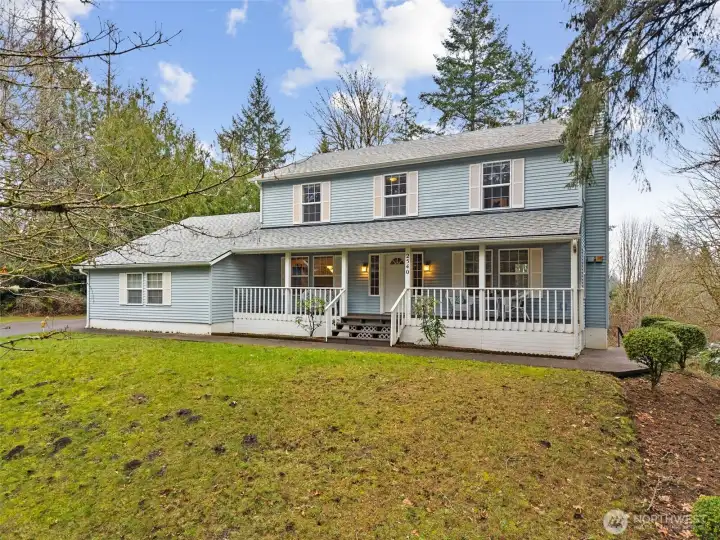 Set above the street, this gracious, traditional style 4 bdrm/3/.25 bath home sits above the road and backs to private woodlands.
