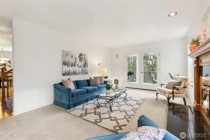 The long art or media walls or room for shelving invite this space to serve many uses like a library or main floor office. The kitchen great room and large rec room on the lower level provide alternative spaces too.