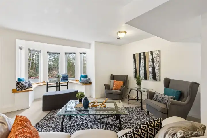 The front area of the lower living level is well suited for dining, daily living, a big screen TV or large lobby for a home office. Imagine a kitchenette here or look into the possibility of a remodel to a full ADU.