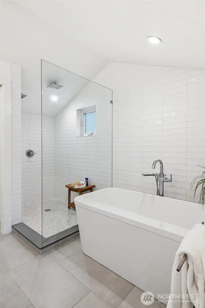 Free-standing bath and large shower provides spa-like luxury
