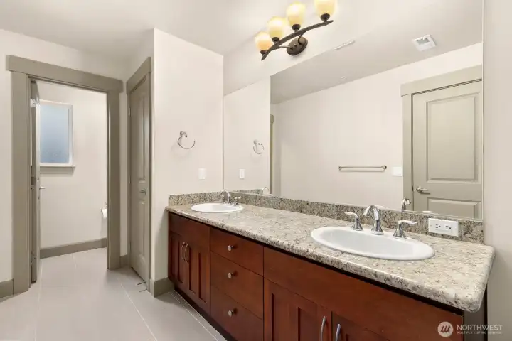 Primary Suite bath w/private toilet and storage closet