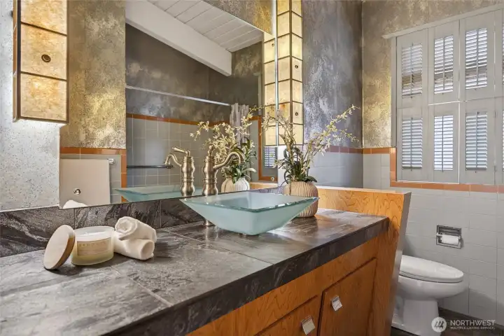 beautifully appointed and artistically designed full bath on the upper level.