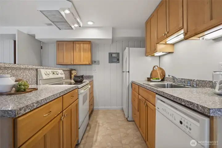 Good-sized kitchen with seating counter.
