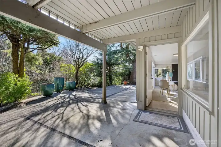 Lower-level walkout to the back patio, garden space, and natural setting. It is very secluded and peaceful here.