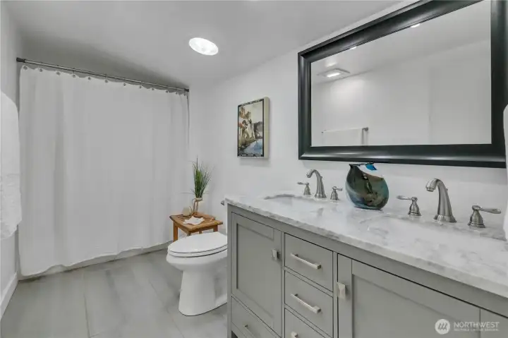 Fully updated bathroom with radiant floor heating & solar tube lighting