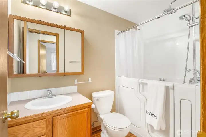 The main bathroom is a full bath with a luxurious step-in tub. Use it just as a shower or step in an fill it up for a spa-like experience! Two shower heads are included for an overall personal experience! (A manual and waterproof instruction guide is included.)