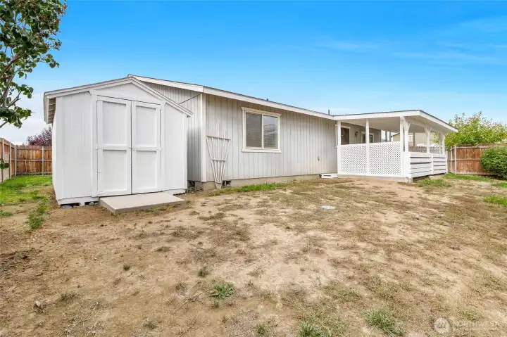 The sturdy shed has fresh paint on the whole exterior and will house all the equipment you need for installing new landscaping.