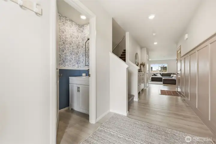 Upon entry, a half bath.