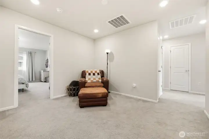 At the top of the stairs is a loft area