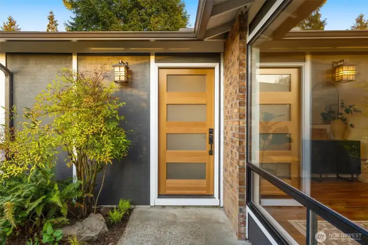 Stunning new modern front door welcomes you in.
