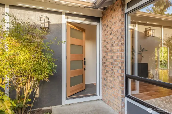Stunning new modern front door welcomes you in.