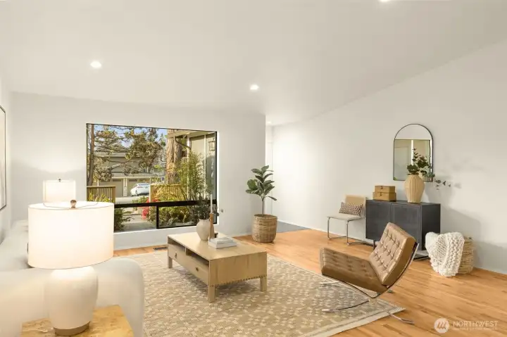 Inside, soaring vaulted ceilings and refinished oak hardwoods create a warm, sophisticated feel.