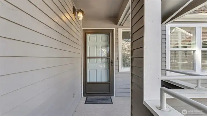 Covered walkway from garage to the front door.