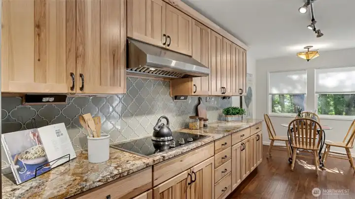 Higher end appliances with sightlines to the living and dining areas.
