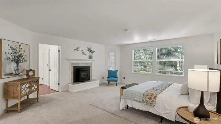 The primary suite is a peaceful retreat with territorial views and a pellet stove with statement mantle.