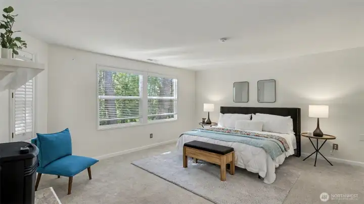 Space for a large bed and seating area in the primary bedroom.