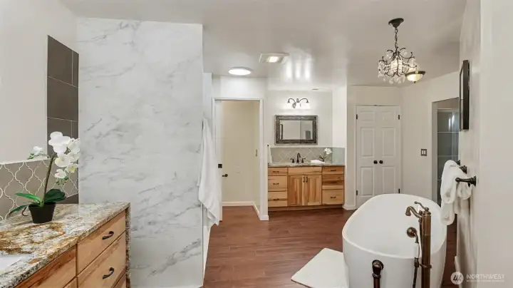 Primary bath also features a new shower, and two large walk-in closets with custom shelving.