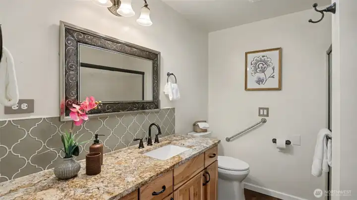Guest bathroom with granite countertops.