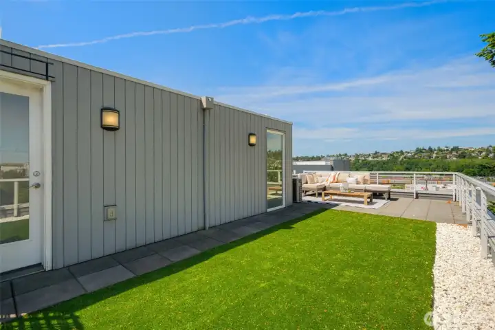 Large rooftop deck with turf.