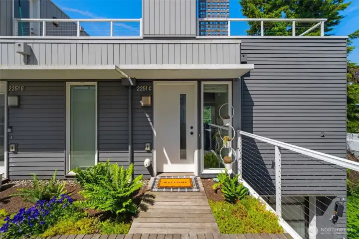 Light filled end unit townhome with attached garage and spacious entertaining spaces.