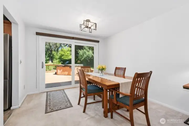 Dining room looks out at large deck and back yard. Dining room looks out at large deck and back yard.