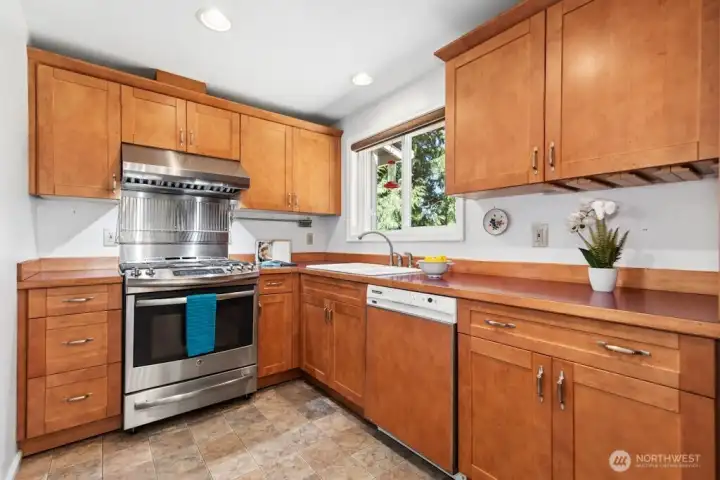 Kitchen features stainless appliances. Kitchen features stainless appliances.