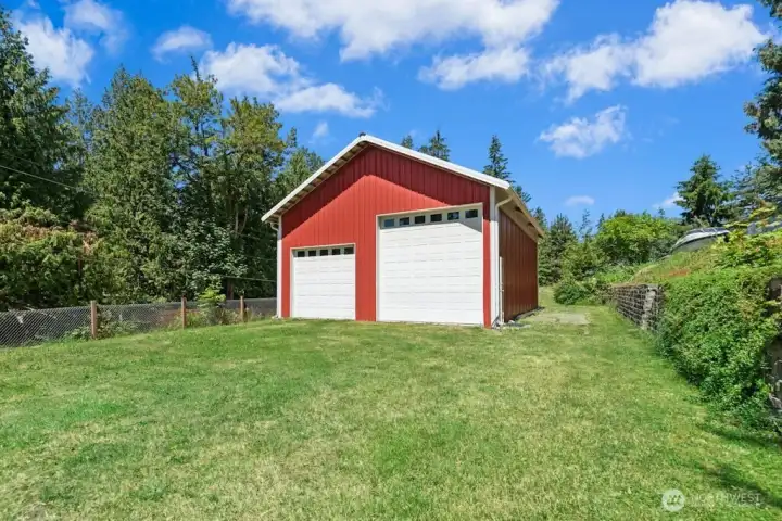 Large 28' x 36' detached garage/shop has two 12' doors and one 9' door. Large 28' x 36' detached garage/shop has two 12' doors and one 9' door.