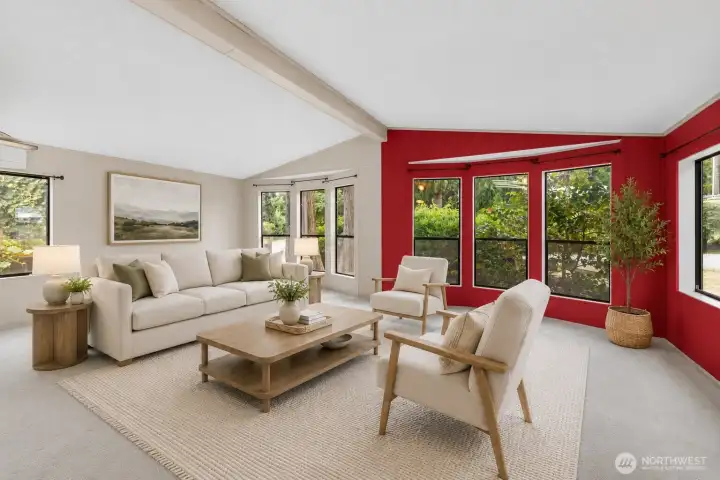 Living room virtually staged. There are peekaboo views of Puget sound out the south facing windows in the living room and dining area