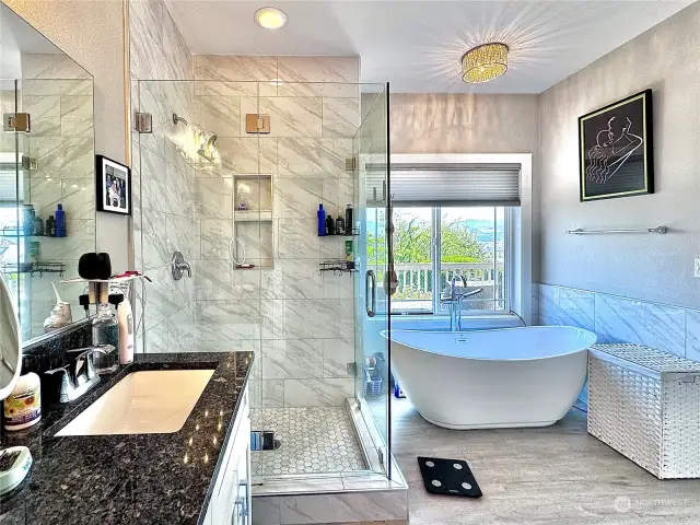 Thoughtfully designed beautifully remolded primary bathroom, with incredible views from your new soaking tub.