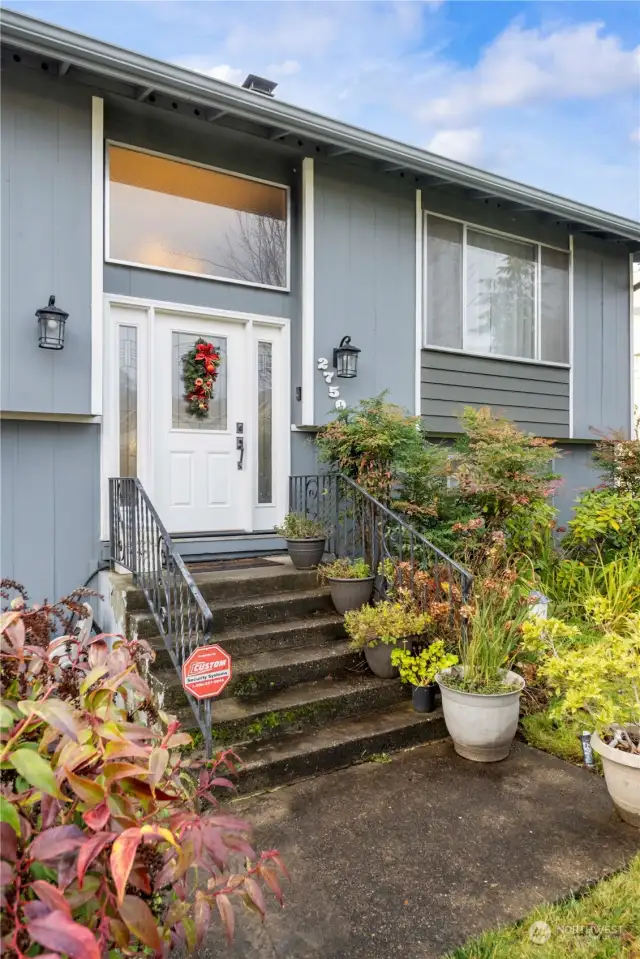 Lush landscaping and a newer coat of exterior paint create nice curb appeal