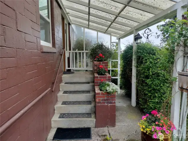 Entering up the stairs to the kitchen.