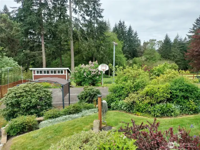Looking from the corner of the house towards the sports coiurt area.