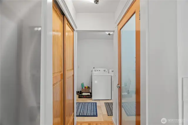 On the left is a coat closet and on the right is the walk-in pantry, through the doorway is the laundry room