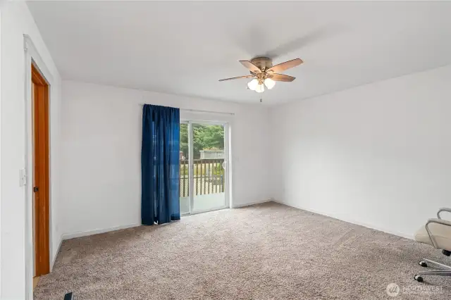Primary bedroom with slider to back deck