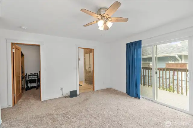 Primary bedroom with bathroom to right, walk-in closet on the left