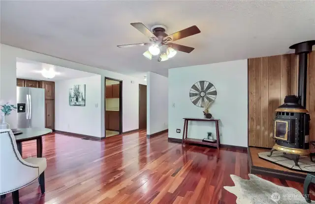 This photo shows the family room in relation to the kitchen at the left. The open door in the middle of the picture iis the laundry area.