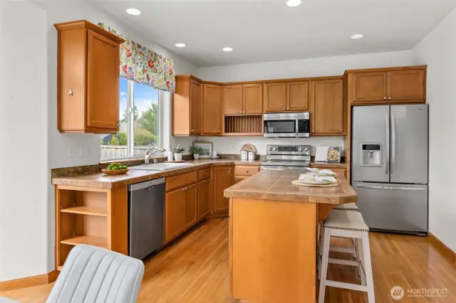 Kitchen features fantastic storage, eating bar, and all appliances are included in sale!