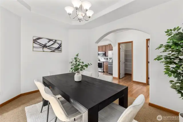 Formal dining area with tray ceiling
