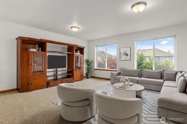 Upstairs loft area with large windows allowing for plenty of natural light *This photo is virtually staged