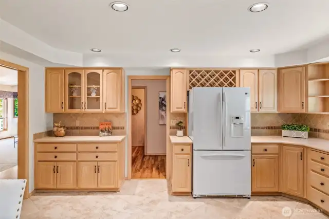 The kitchen has abundant storage space & counter surfaces