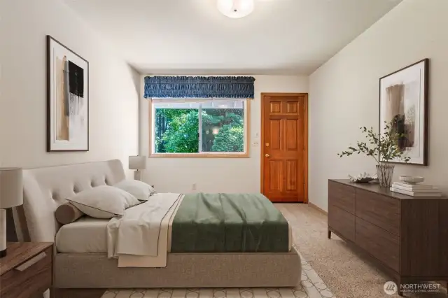 3rd bedroom with door to access large rear deck, digitally staged