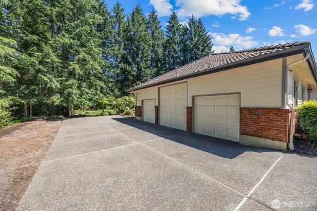 3 car garage with openers, tall ceiling, extra wide & deep.