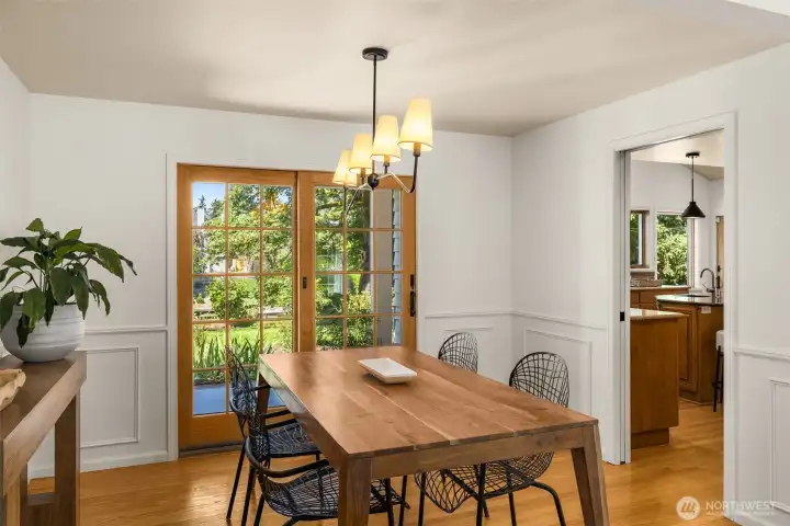 The dining room glows with natural light from oversized windows. A perfect balance of elegance and comfort, it’s equally suited for cozy family meals or festive holiday gatherings.