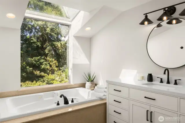 This tub sits beneath a wide window with treetop views. Perfect for spa nights where you can gaze at the stars.