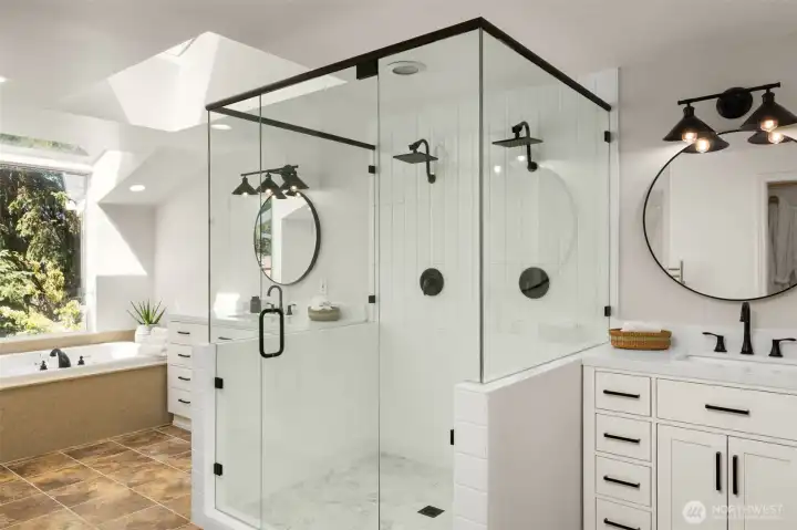 A glass-enclosed shower with rainfall fixtures and custom tile work creates a retreat-like experience. It’s a space that refreshes and rejuvenates.