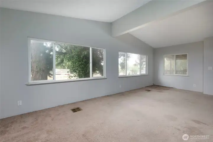Living room with vaulted ceiling.