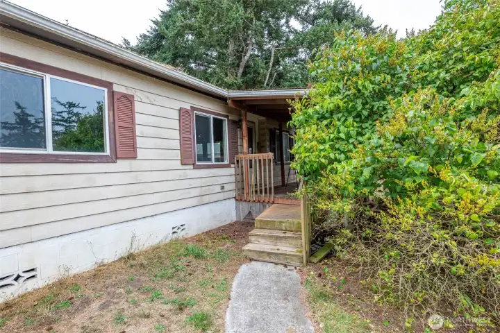 Walkway leading to covered front porch.