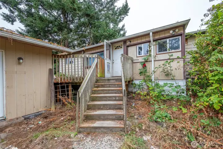 Back porch with door leading to laundry room..